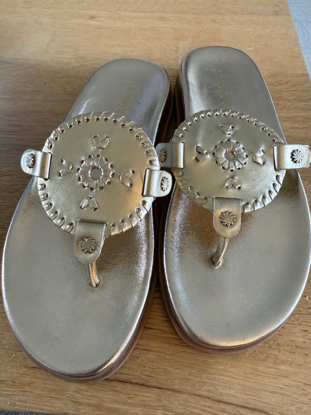 Jack Rogers Gold Leather Stitched Medallion Thong Sandals.